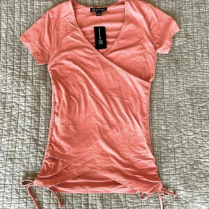 Peach top with ties on the sides